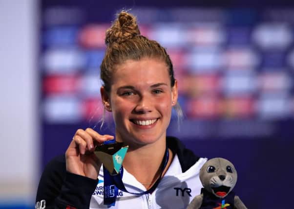 Grace Reid shows off her gold medal. Pic: PA