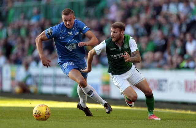 Hibernian's Martin Boyle (right) vies with Molde's Stian Gregersen (left) during the UEFA Europa League third qualifying round, first leg match at Easter Road, Edinburgh. PRESS ASSOCIATION Photo. Picture date: Thursday August 9, 2018. See PA story SOCCER Hibernian. Photo credit should read: Graham Stuart/PA Wire