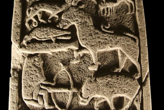 A section of one of the remarkable St Vigeans stones which includes a depiction of a hunter with a crossbow and a boar. PIC: Crown Copyright HES.