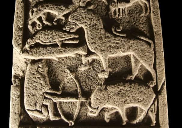 A section of one of the remarkable St Vigeans stones which includes a depiction of a hunter with a crossbow and a boar. PIC: Crown Copyright HES.