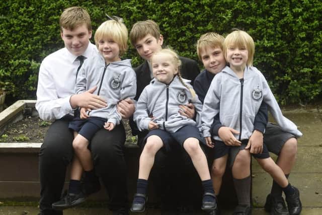 Triplets about to start primary school together (left to right) Reuben, Kara and Sam who all just turned 5. Also pictured with their big brothers (left to right) James (15), Daniel (12) and Ben (10). Surname is Taylor. Picture; Greg Macvean