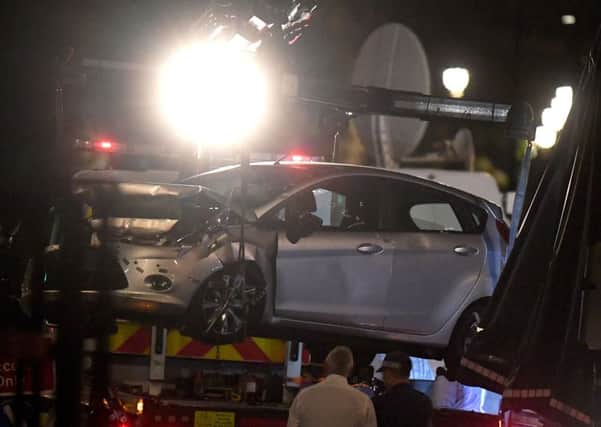 Police recover the car driven by a 29-year-old man, who is a UK national, who was arrested on suspicion of preparing an act of terror. Picture: Victoria Jones/PA Wire