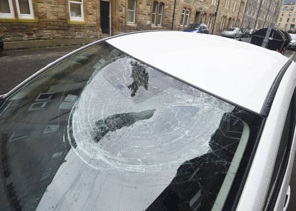 Damaged cars on Upper Grove Place off Grove Street