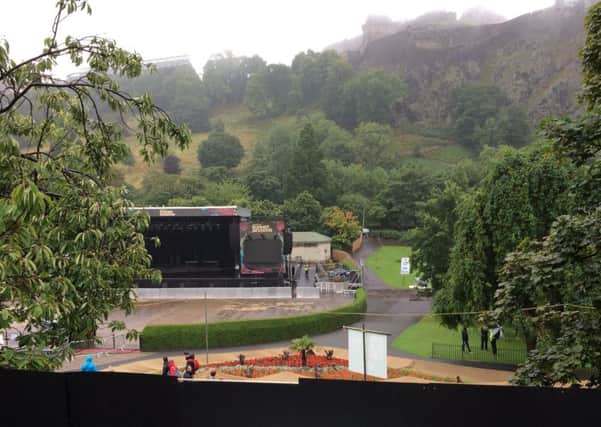 View of Princes Street gardens - taken from the bus - showing the black boards which have been put up to stop people viewing the concerts in the gardens for free.