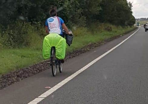 The cyclist was pulled over and escorted by police.