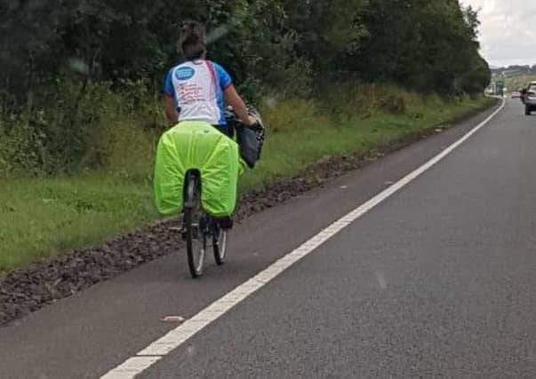 The cyclist was pulled over and escorted by police.