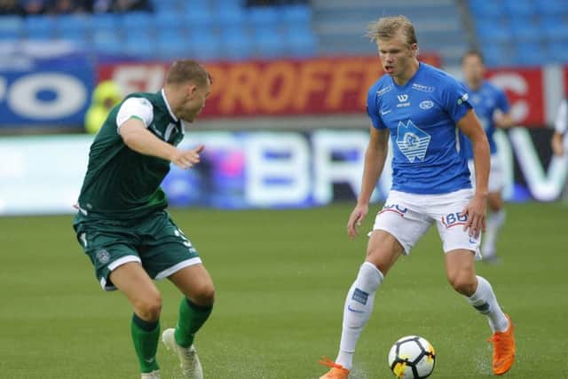 Hibs defender Ryan Porteous tries to stop Molde striker Erling Braut Haaland
