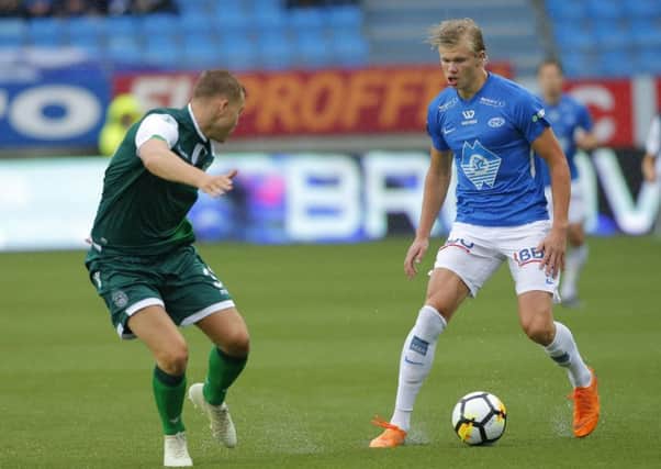 Hibs defender Ryan Porteous tries to stop Molde striker Erling Braut Haaland
