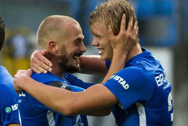 Erling Braut Haaland, right, celebrates scoring Molde's third goal against Hibs