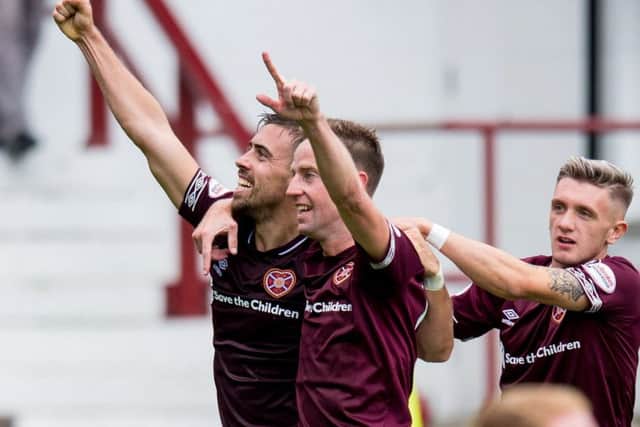 Olly Lee , left, scored at Dunfermline to put Hearts into the last eight