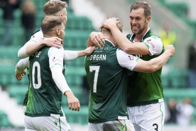 The Hibs players celebrate after Daryl Horgan netted his late winner. Picture: SNS