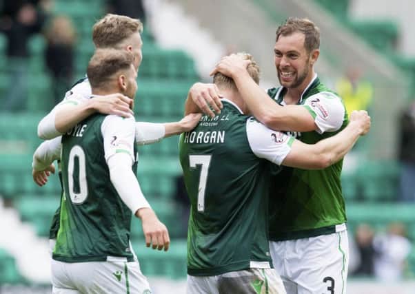 The Hibs players celebrate after Daryl Horgan netted his late winner. Picture: SNS