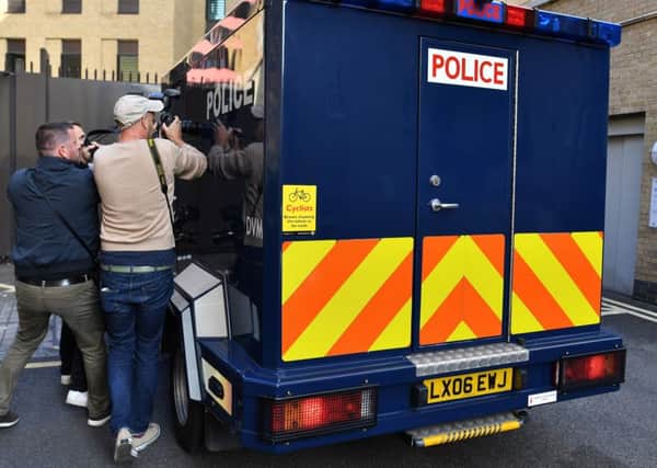 A police van suspected of carrying Salih Khater arrives at Westminster Magistrates. Picture: AFP/Getty
