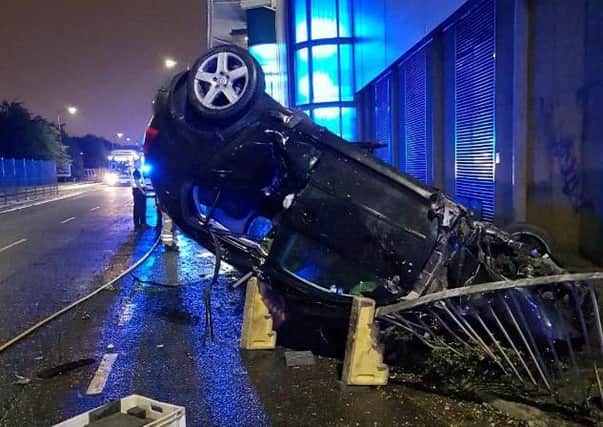 The collision left one car on its roof. Picture: Road Policing Scotland/Twitter