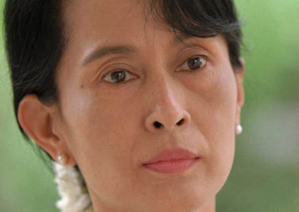 Myanmar's  leader Aung San Suu Kyi talks during an interview at her residence in Yangon in this May 25, 1996 file photo.