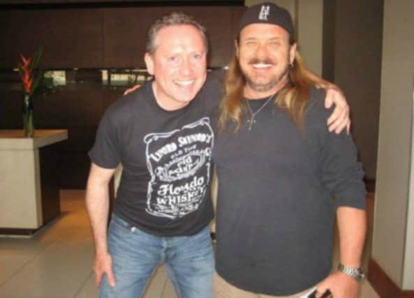 Iain with Lynyrd Skynyrd lead singer, Johnny Van Zant.A Gullane man has contributed to a book about legendary American rock band Lynyrd Skynyrd.