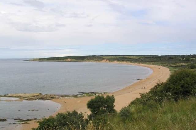 Clothes left at a Gullane beach have sparked a police search with officers concerned that a women may have entered the water.