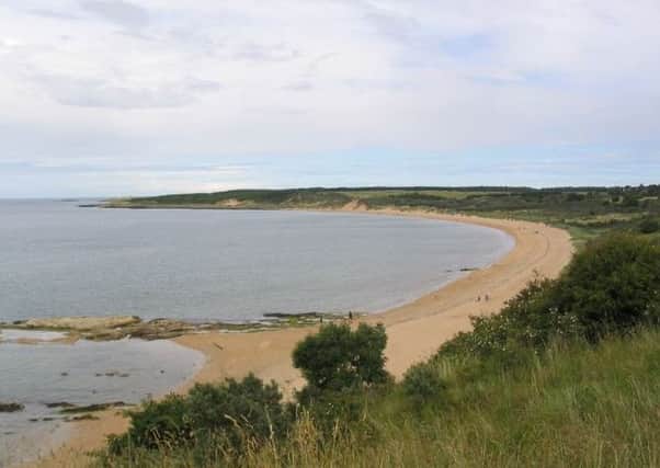 Clothes left at a Gullane beach have sparked a police search with officers concerned that a women may have entered the water.
