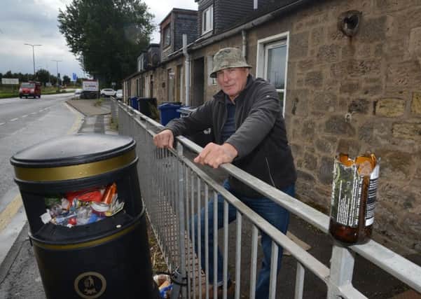 John Hutchison who is not happy about the state of the local bins. Picture: Jon Savage