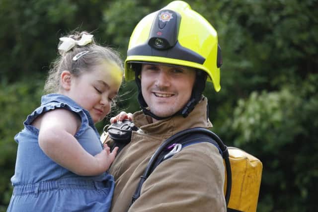 Volunteer firefighter Dean Ballantyne with daughter Chloe, who needs stem cell treatment. Picture: Alistair Linford
