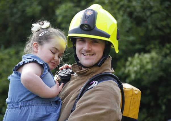 Volunteer firefighter Dean Ballantyne with daughter Chloe, who needs stem cell treatment. Picture: Alistair Linford
