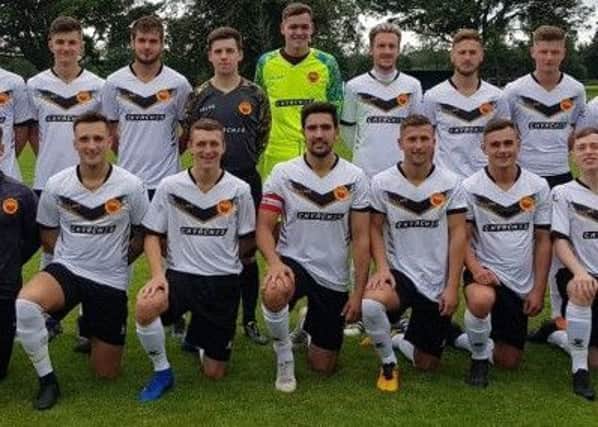 Whitburn Juniors in their new away strips, which are sponsored by Glasgow band Chvrches