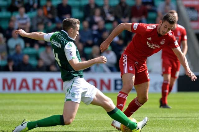 Paul Hanlon challenges Dominic Ball during Saturday's clash with Aberdeen