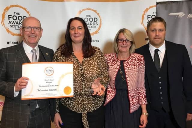 Staff from the Coronation restaraunt in Gorebridge with their Food Awards Scotland regional certificate and national award.