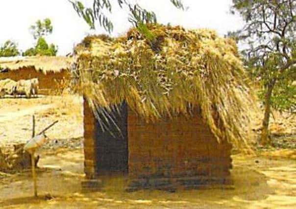 Christine Grahame twinned the toilet in her constituency office with this latrine in Malawi