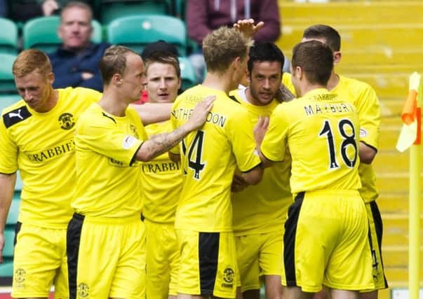 Tim Clancy (third from right) celebrates his goal with his team-mates