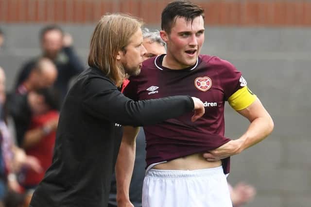 Hearts coach Austin MacPhee, pictured alongside John Souttar, believes the defender has learned from senior members of the squad. Pic: SNS