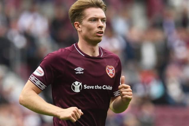 Craig Wighton scored two goals and set up another as Hearts thumped United
