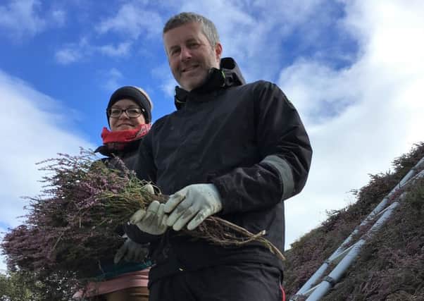 Neil Nicholson and his apprectice Marion of Hebridean Thatching Services at Leanach Cottage, Culloden. PIC: NTS.