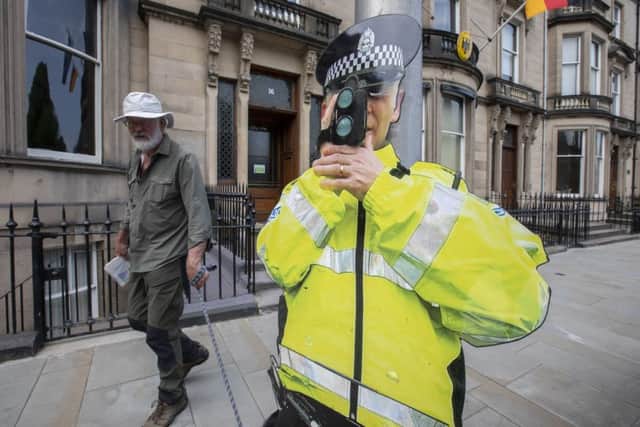 A cut-out Police Officer on Eglington Crescent, Haymarket. Picture: SWNS