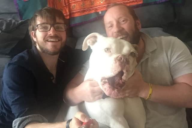 Gordon and Euan, left, love their pet pooch Bear who is like a  seven-stone baby. Picture: Contributed
