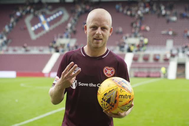 Hearts' Steven Naismith with the match-ball after his hat-trick. Picture: SNS/Craig Foy