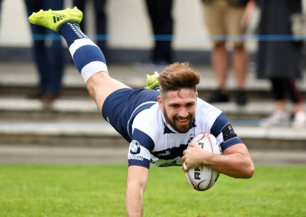 Craig Robertson goes over for Heriot's second try