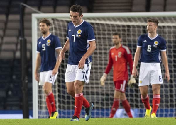 John McGinn and his Scotland colleagues feel the pain of Friday's hammering by Belgium
