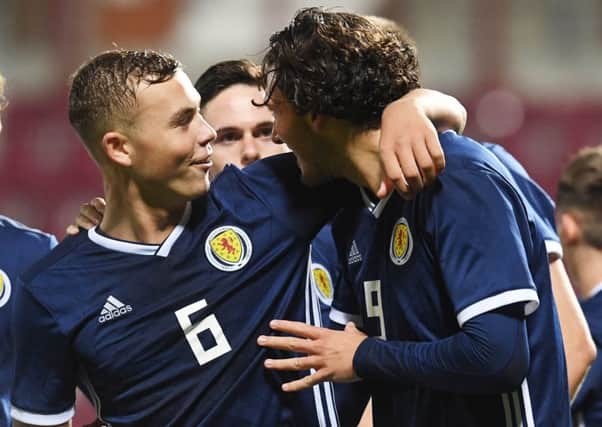 Fraser Hornby, right, celebrates the first of his three goals against Andorra with Ryan Porteous