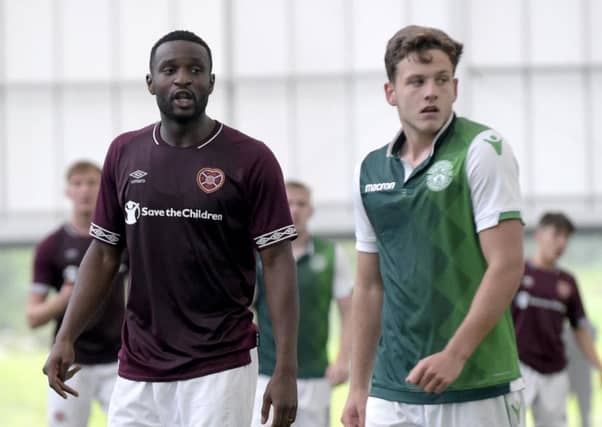 Clevid Dikamona (28) and Jamie Gullan (19) in action for Hearts and Hibs in the SPFL Reserve League Cup at Oriam. Picture: Lisa Ferguson