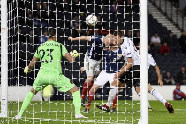 Steven Naismith (centre) stoops to score via the head of Berat Xhimshiti, who was credited with an own goal. Picture: Ian Rutherford/PA Wire
