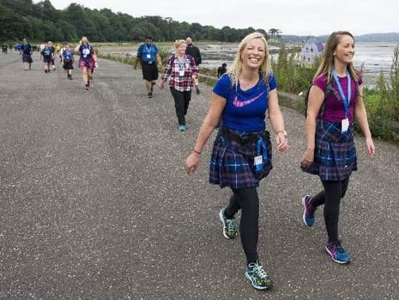 Kilt walkers walk along the sea front at Crammond in 2016. Picture: Ian Rutherford