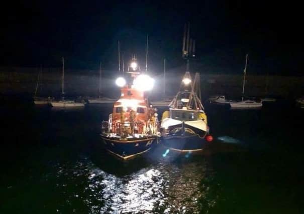 Dunbar Lifeboat Volunteers saved their fellow RNLI member on Tuesday night.
