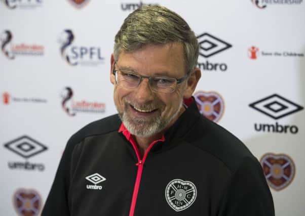 Craig Levein is happy to be back at work