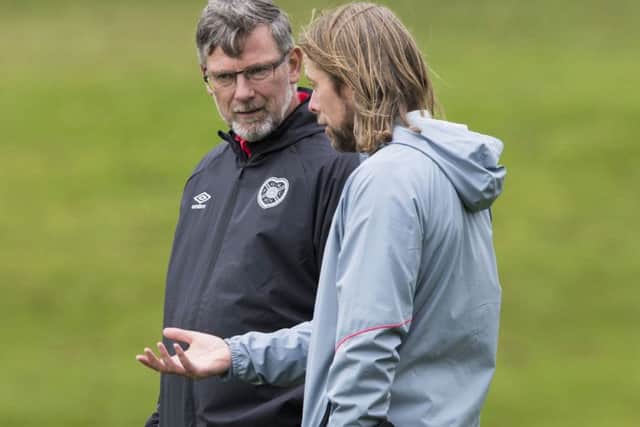 Levein with assistant Austin MacPhee at training