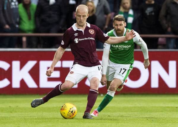 Martin Boyle and Steven Naismith vie for the ball - the pair are both in the combined team. Picture: SNS  Group