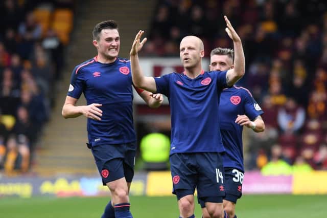 Hearts' Steven Naismith celebrates scoring the first goal of the game. Picture: SNS