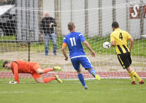 Connor McGregor strokes home his penalty for Lothian Thistle Hutchison Vale. Pic: Greg Macvean