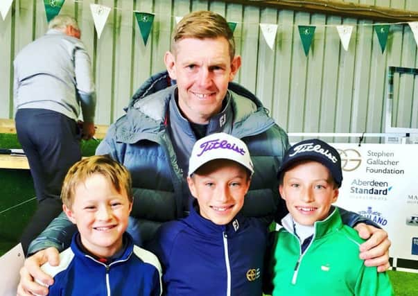 Stephen Gallacher with the Mukherjee boys - Cameron and twins Samuel and Oliver  at Kingsfield