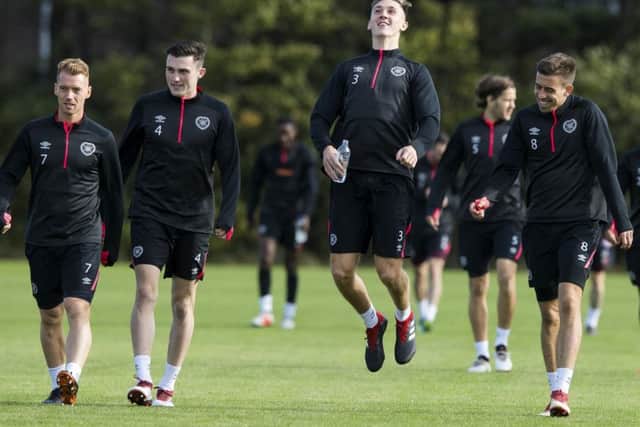 Hearts players Oliver Bozanic, John Souttar, Jimmy Dunne and Olly Lee limber up in training